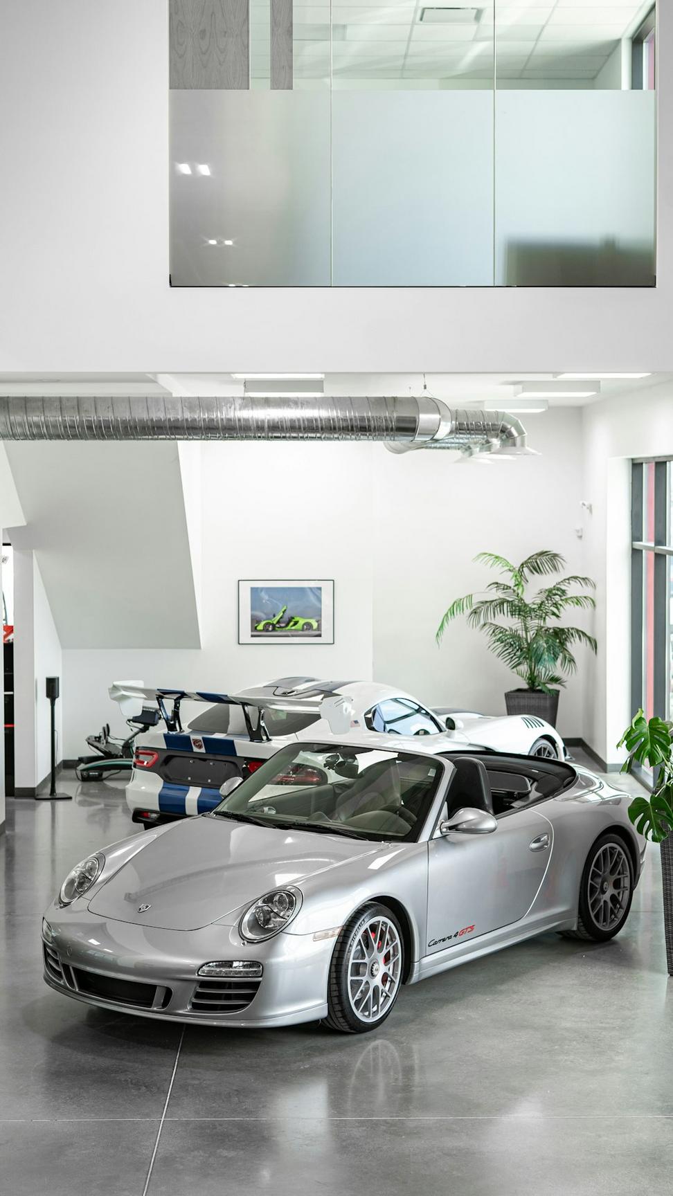 Technician working on luxury vehicle